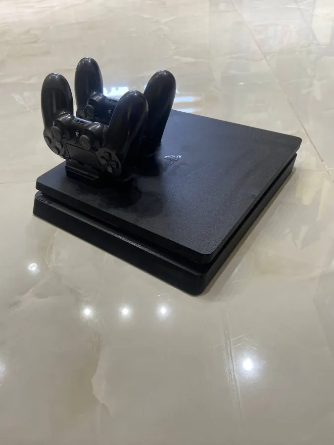 PlayStation 4 Slim 1 TB with two controllers