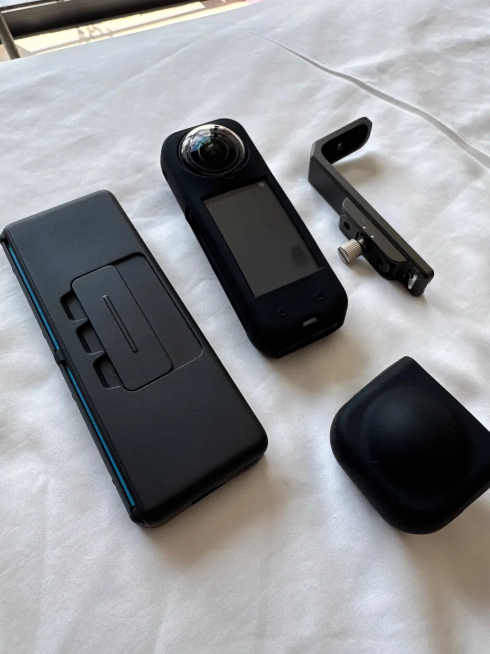 Insta360 X5 camera with two batteries